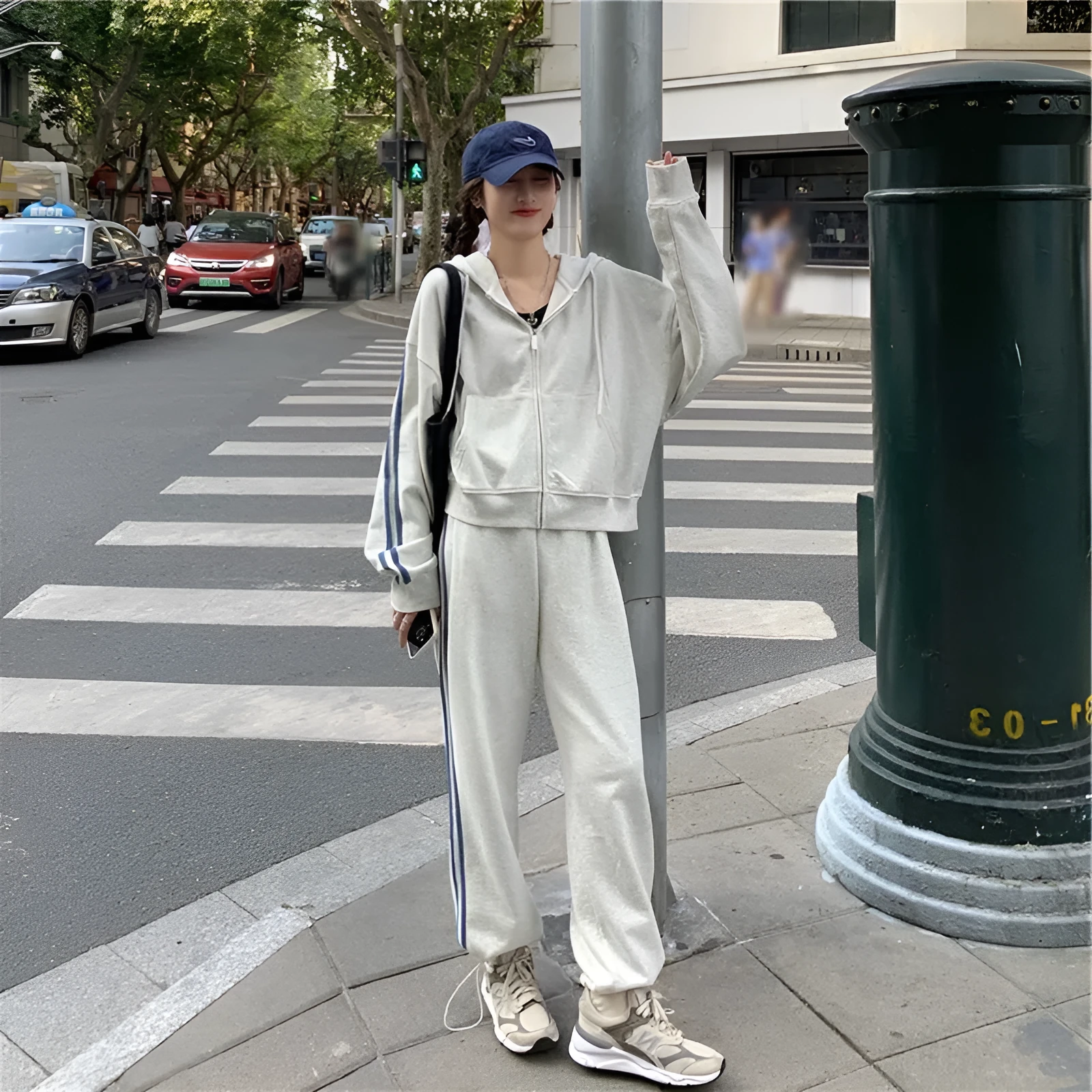 Striped polyester two-piece pants suit set for women in light gray or black with top and trousers coordinated