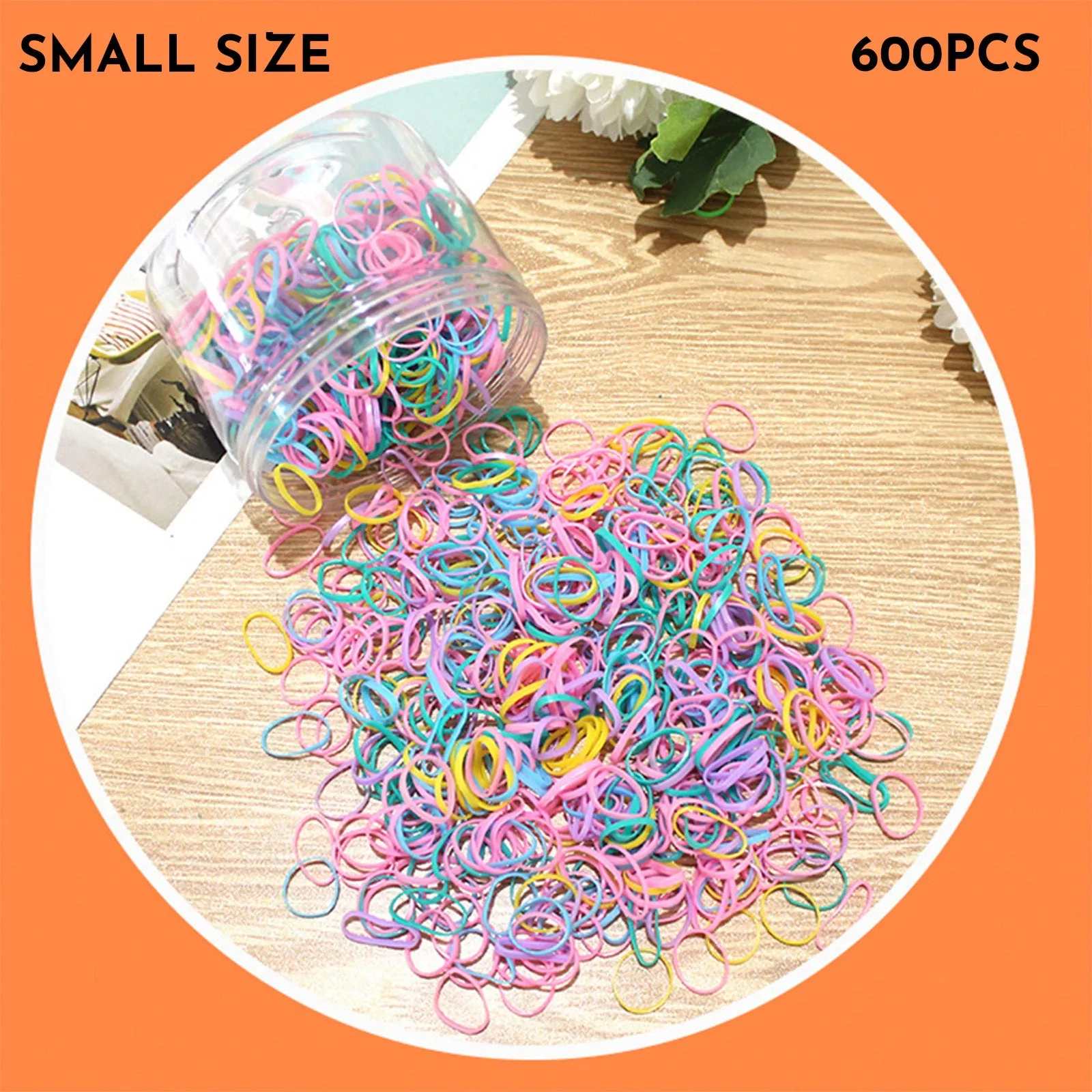 Multi-colour assortment of thin TPU baby hair ties in a re-useable plastic storage container.