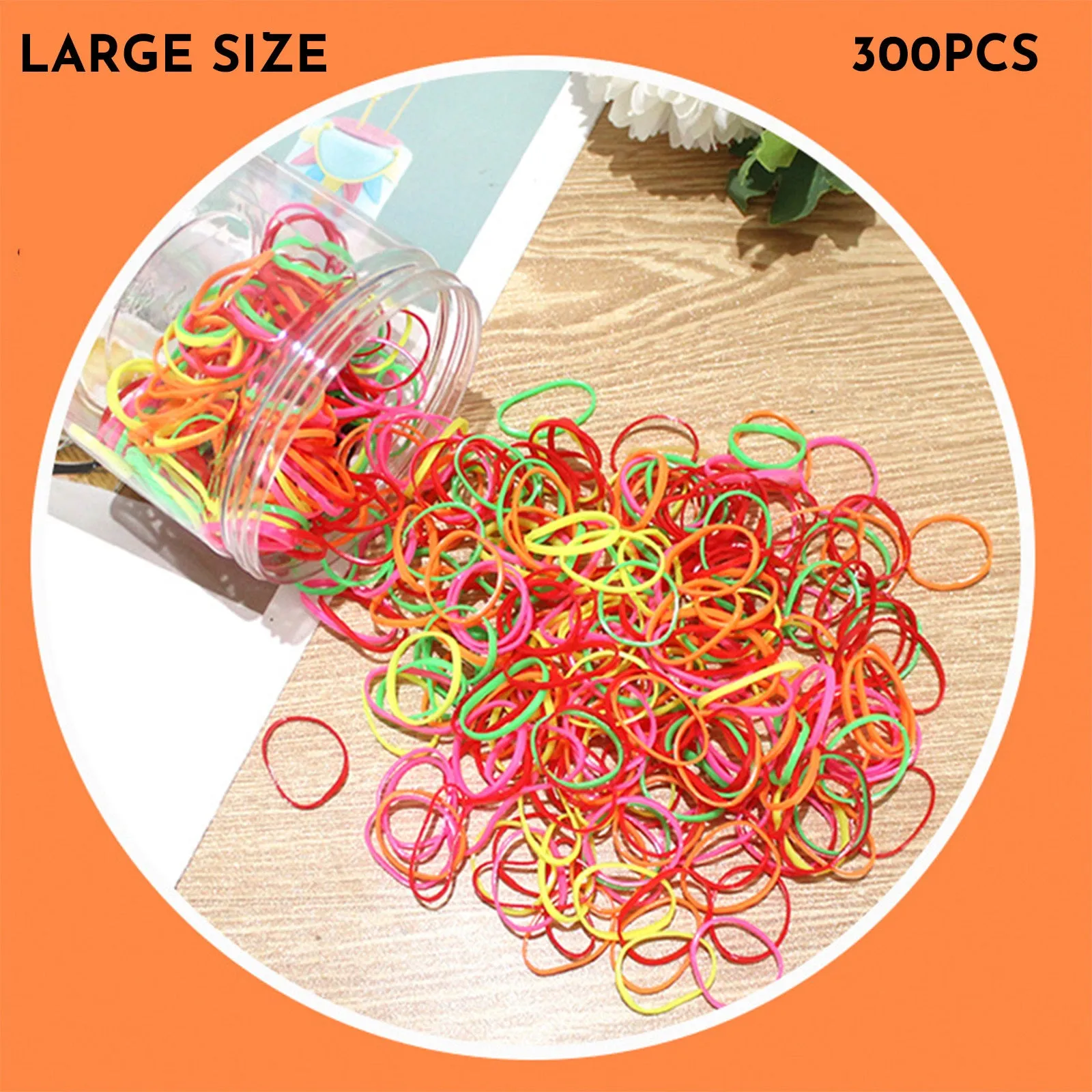 Multi-colour assortment of thin TPU baby hair ties in a re-useable plastic storage container.