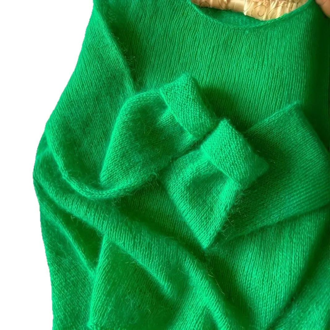 Green crew neck loose fit long sleeve polyester pullover sweater for women on plain background