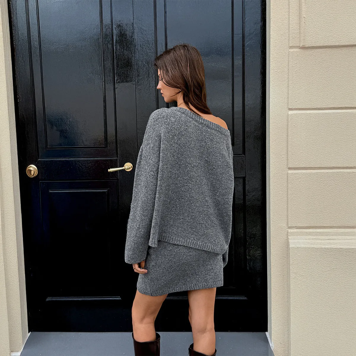 Women's solid grey wool blend knit sweater and skirt suit with long sleeves, shown as a two-piece casual set