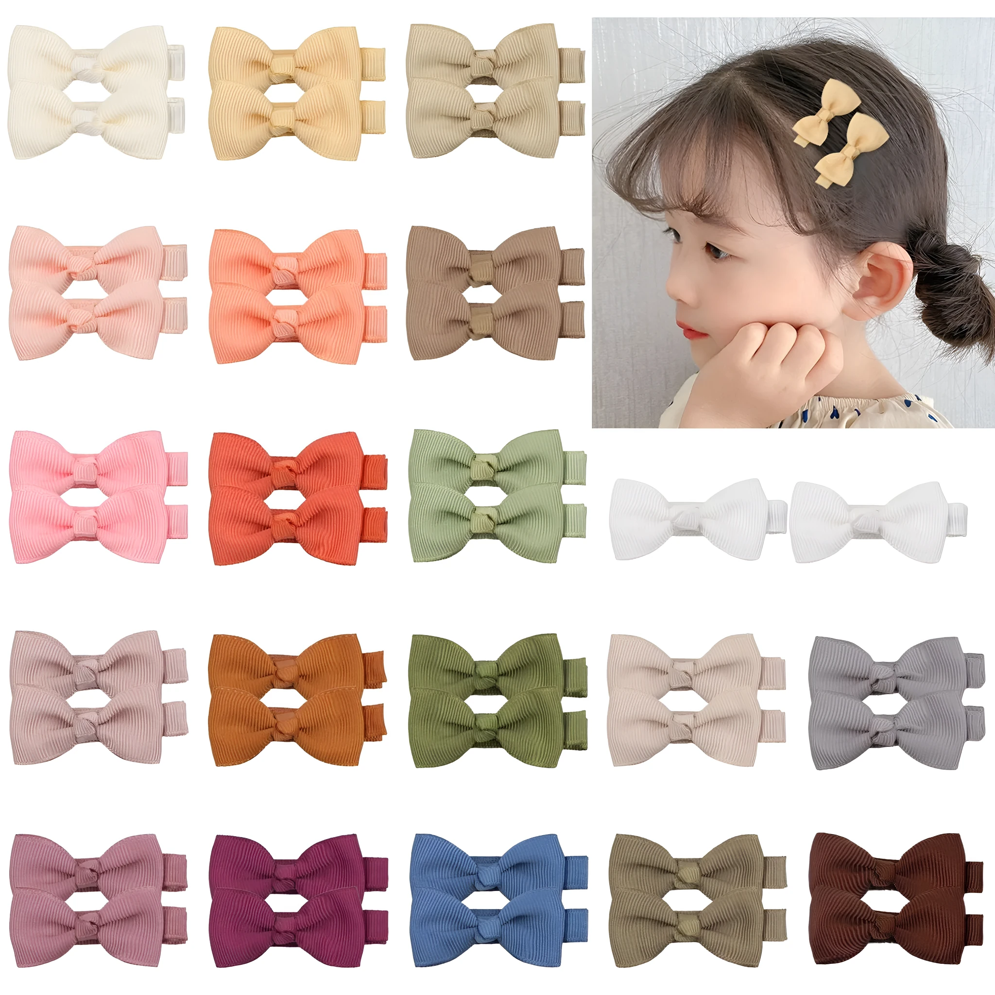 Assortment of pastel-coloured fully lined hair clips and bows for babies and toddlers.