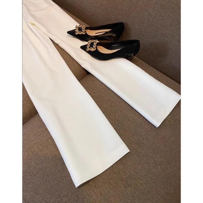 White polyester women's formal suit set with blazer top and matching trousers