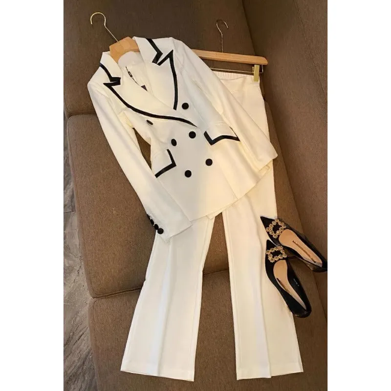 White polyester women's formal suit set with blazer top and matching trousers
