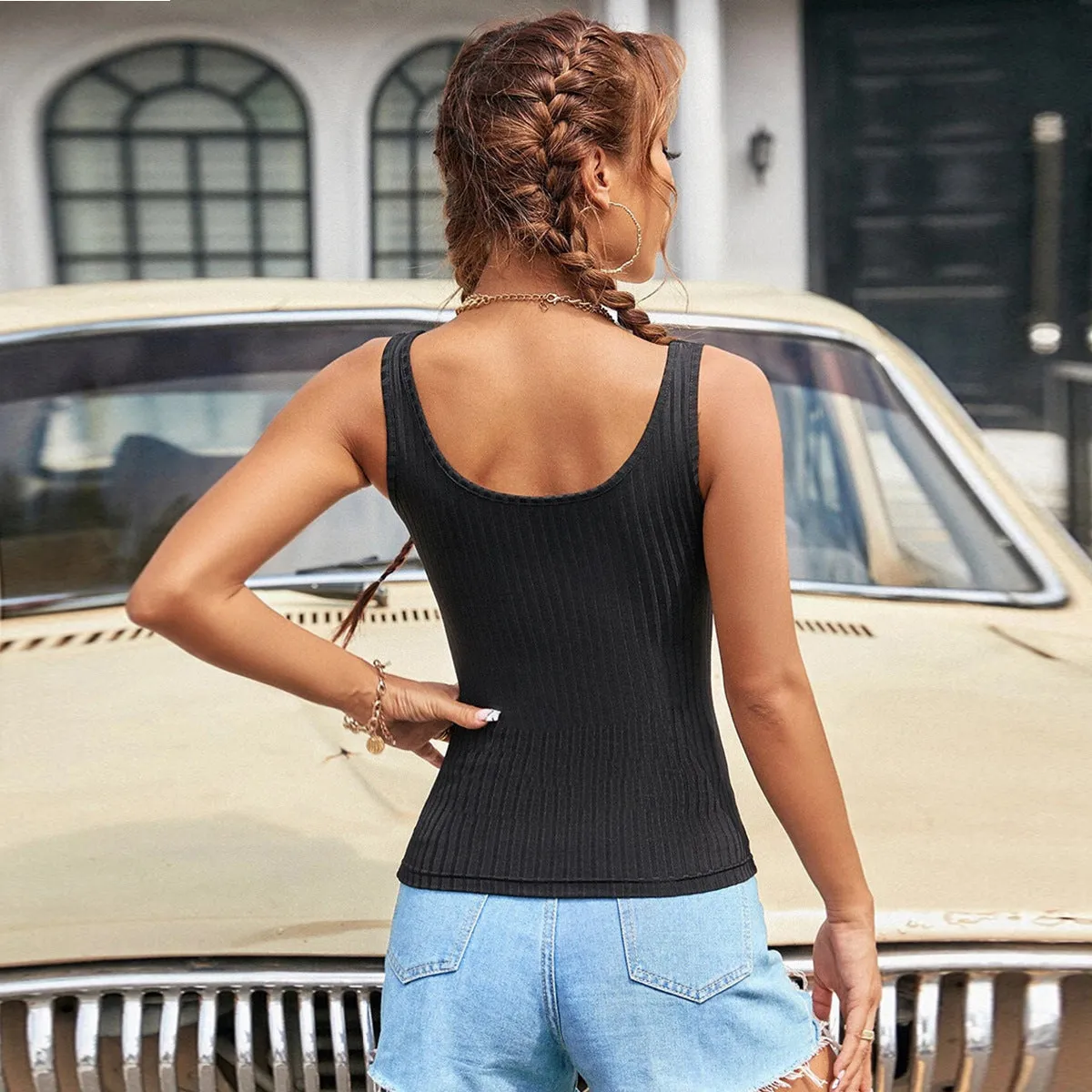 Women's slim-fit solid colour polyester tank top with boat neckline and backless design in black