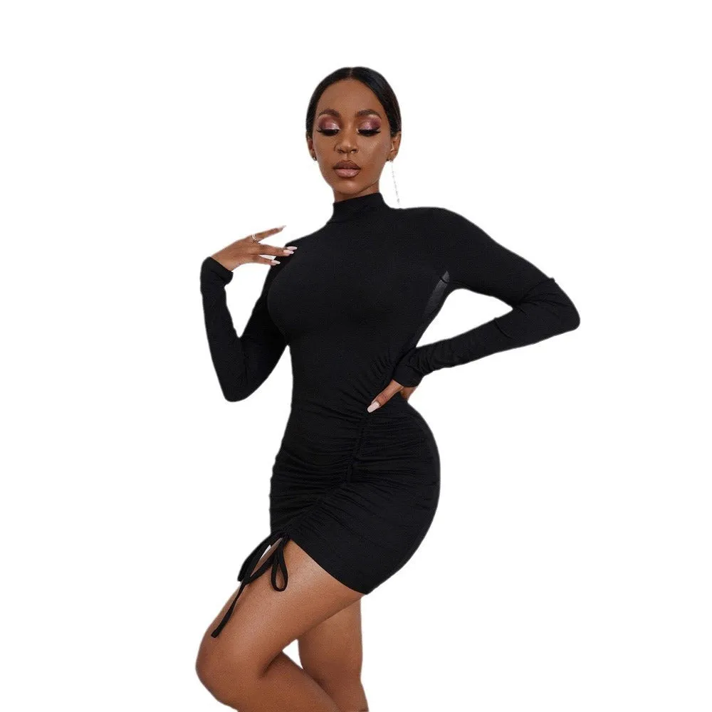 Sexy backless ruched high-neck long-sleeve knit dress in black pencil style on a model