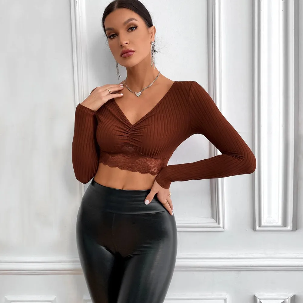 Solid colour women's slim fit long sleeve polyester top in black, front view