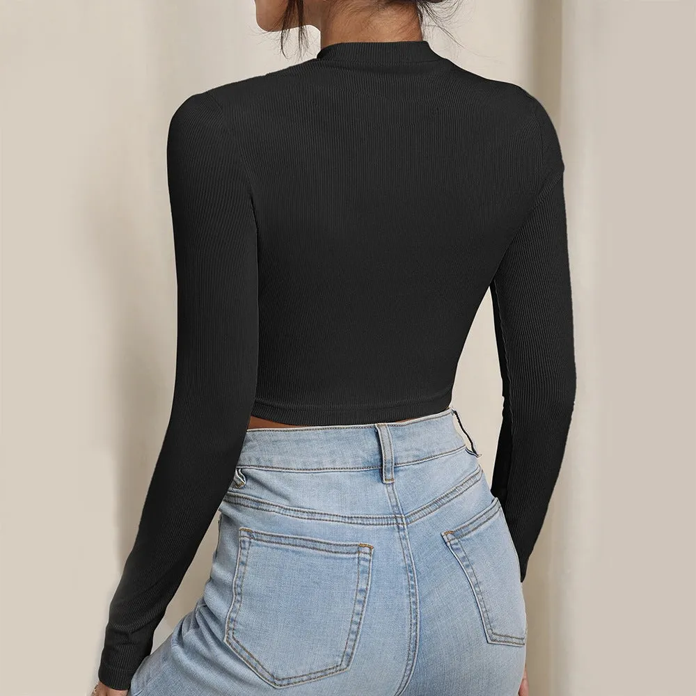 Women's slim-fit hollow-out top in black with high neck, long sleeves, and ribbed texture
