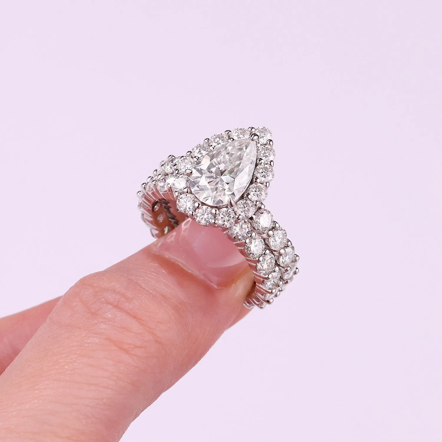 Love ring with pear-shaped moissanite on S925 silver band platinum-plated finish sizes 5 to 9