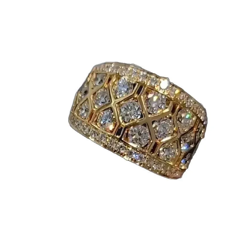 Gold copper ring with geometric quadrilateral hollow-out design and diamond inlay on white background