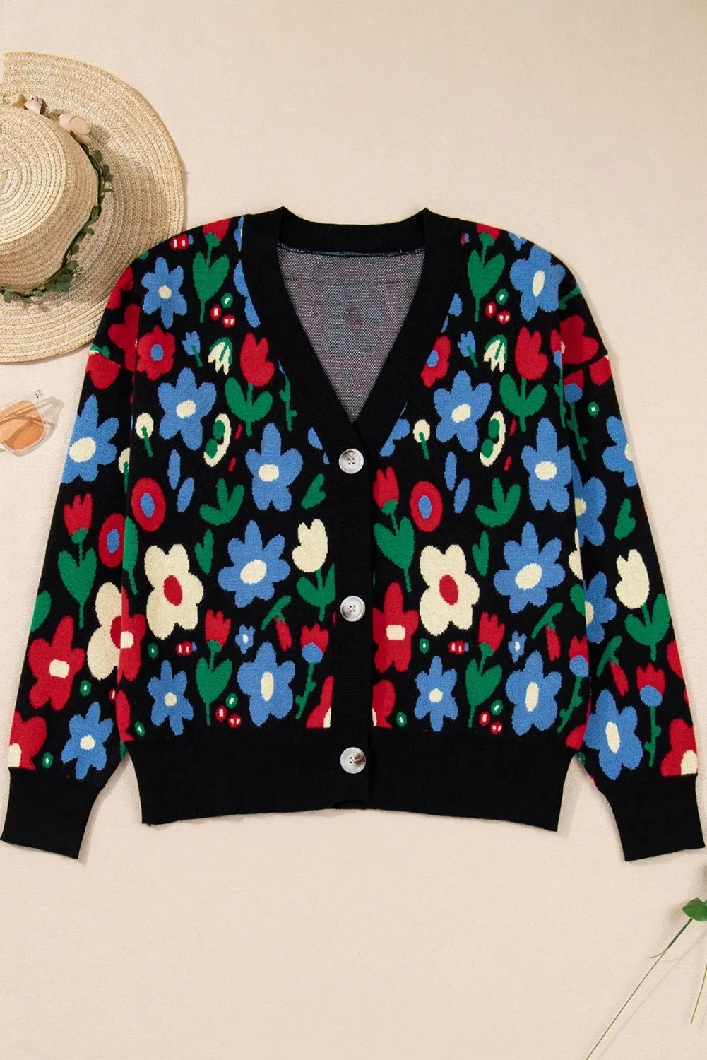 Black floral print V-neck button short cardigan sweater on model, long sleeves, shift silhouette