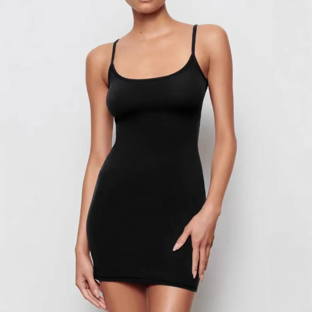 Black skinny sheath sling dress with sleeveless design and mid-waist cut
