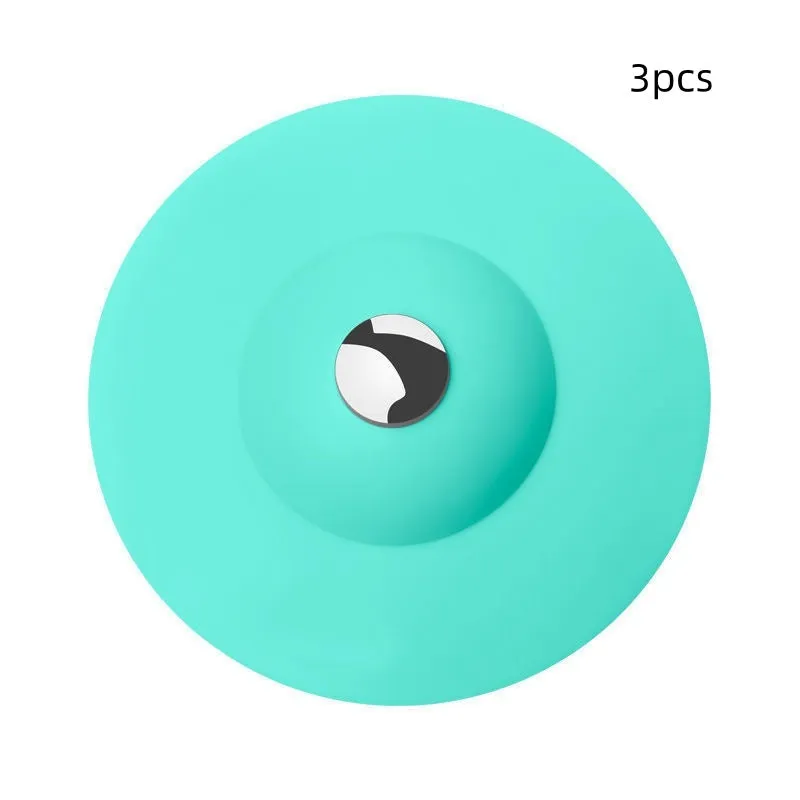 UFO-style silicone press sink drain cover in blue on a white basin, modern minimalist design