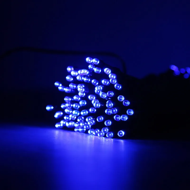 Solar outdoor LED colour light string with 22m 200 lights draped along a garden fence at dusk, showing warm white illumination and weatherproof construction