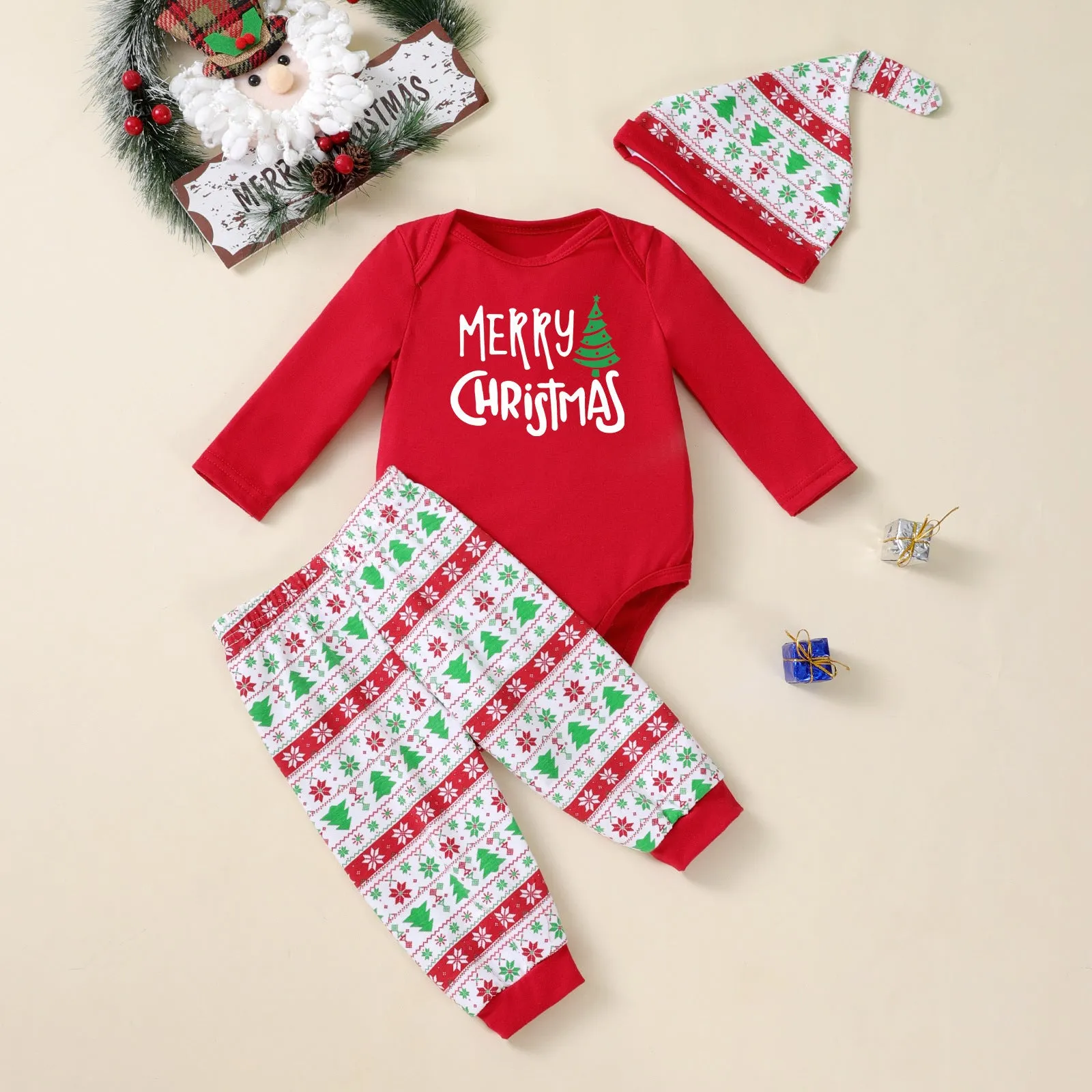 Baby Christmas tree print long-sleeve bodysuit, pants, and hat three-piece outfit on a white background