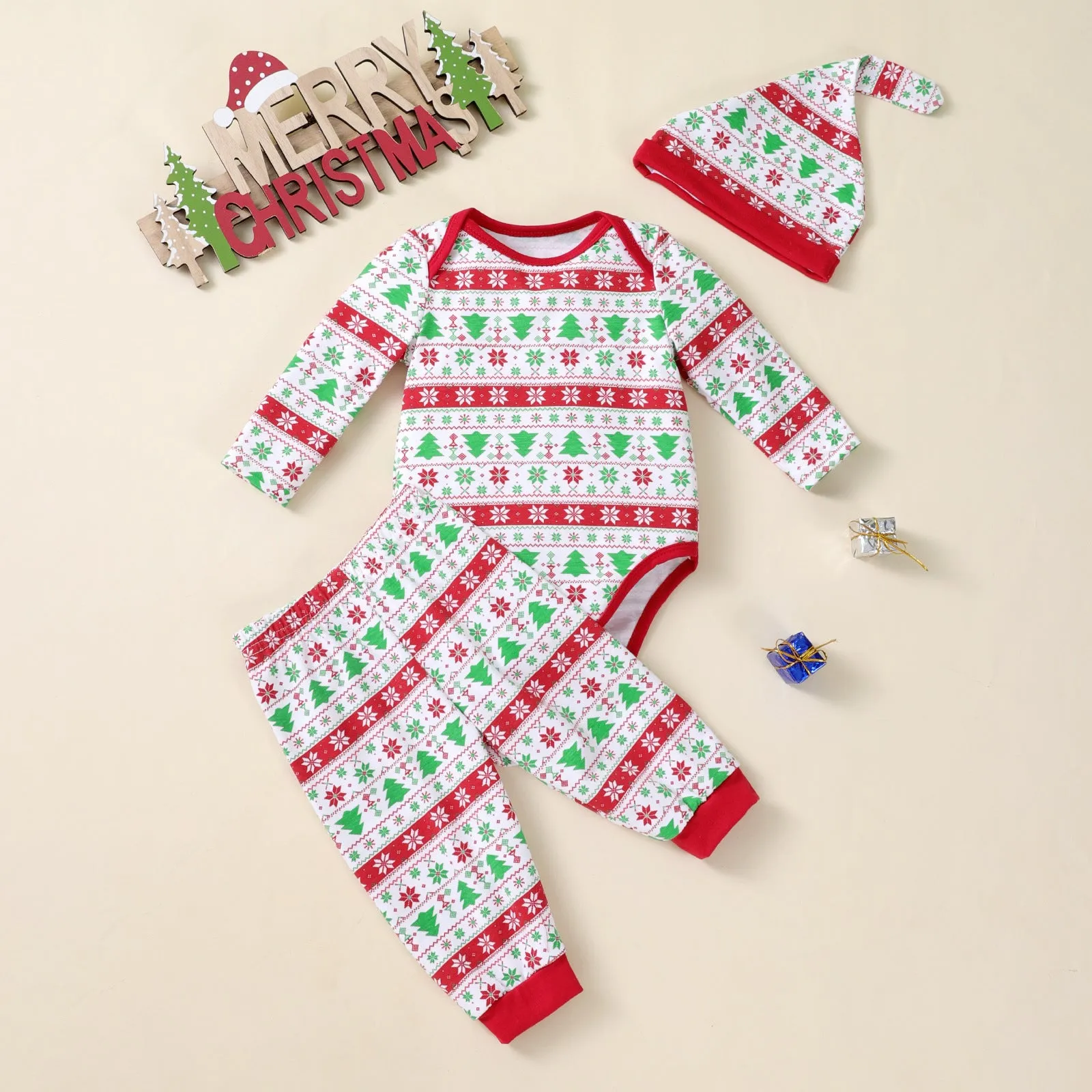 Baby Christmas tree print long-sleeve bodysuit, pants, and hat three-piece outfit on a white background