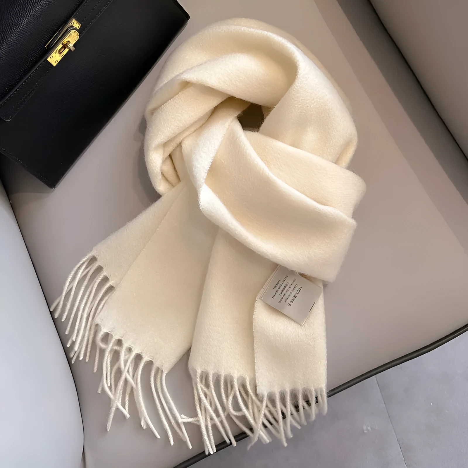 Pure wool mid-length narrow scarf with tassel detailing in beige, 180x32 cm, laid flat