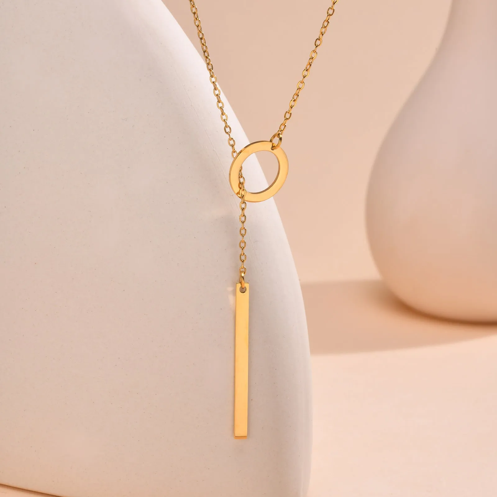 Gold electroplated stainless steel cross and ring geometric pendant necklace on O-link chain