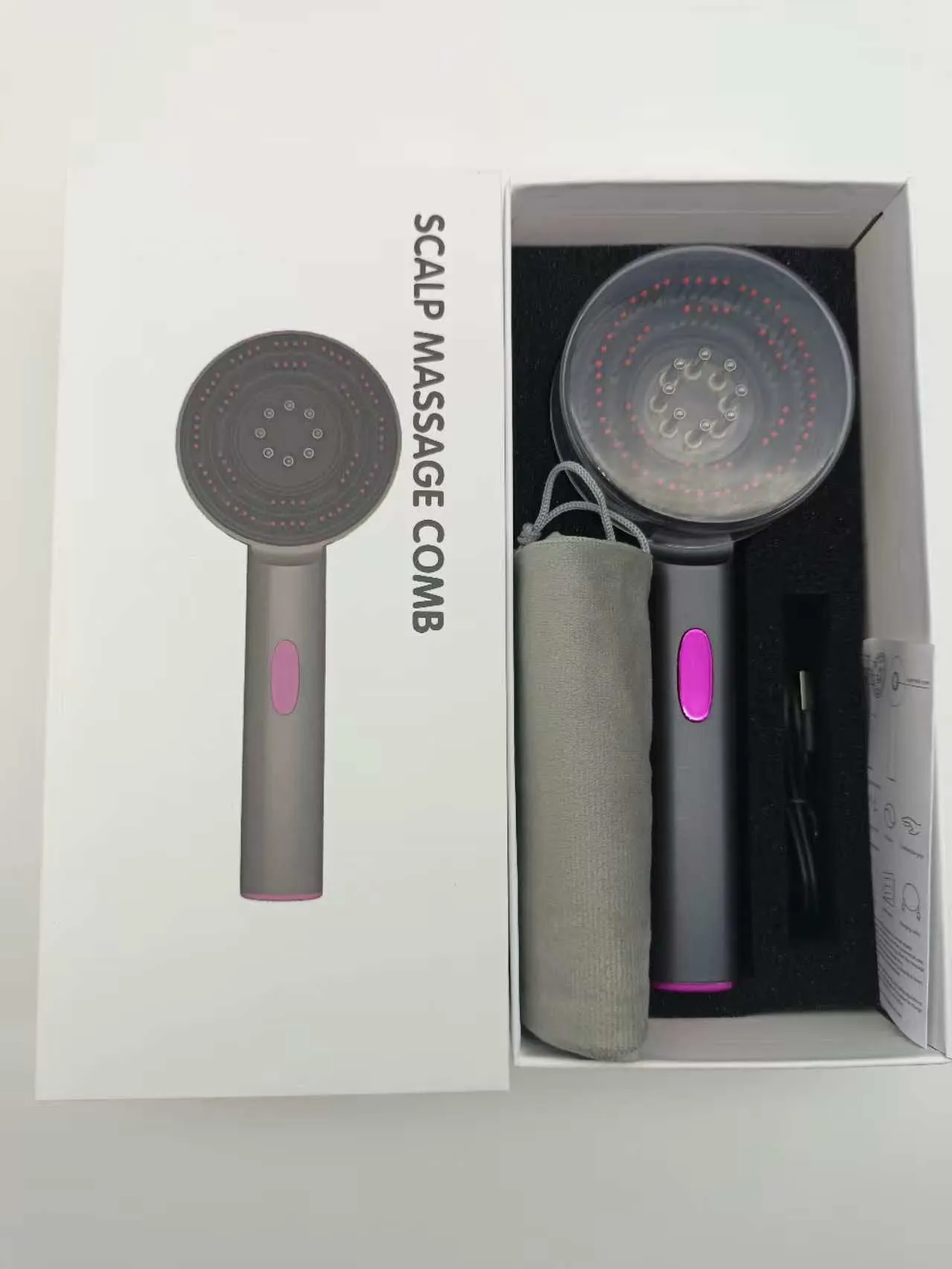 Electric scalp comb with red light and massage function in gray colour for home hair care use
