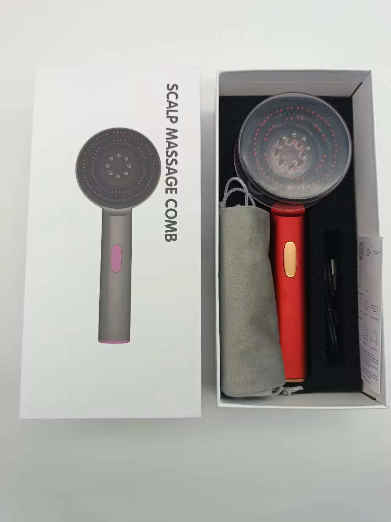 Electric scalp comb with red light and massage function in gray colour for home hair care use
