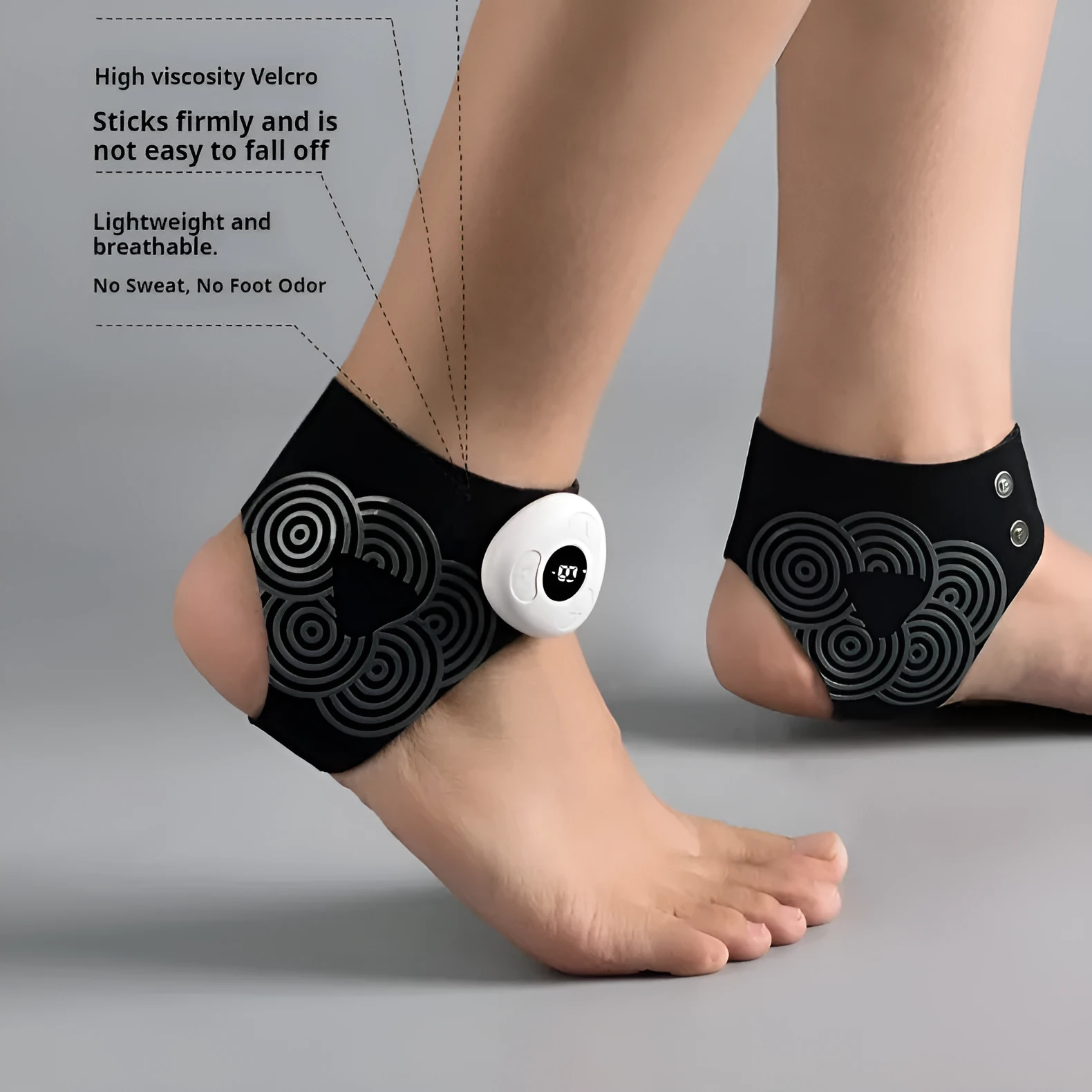 Black sports anti-odor foot massager with adjustable ankle strap and spray bottle on a table