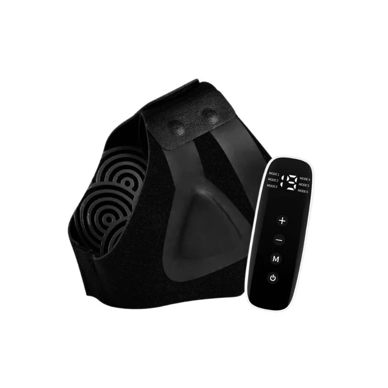 Black sports anti-odor foot massager with adjustable ankle strap and spray bottle on a table