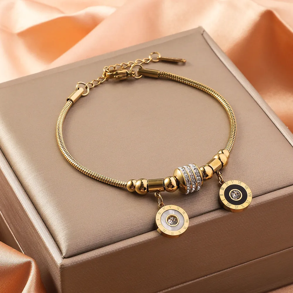 Titanium steel bracelet with electroplated colour and an inlaid shell design, showing pattern options like a five-pointed star.