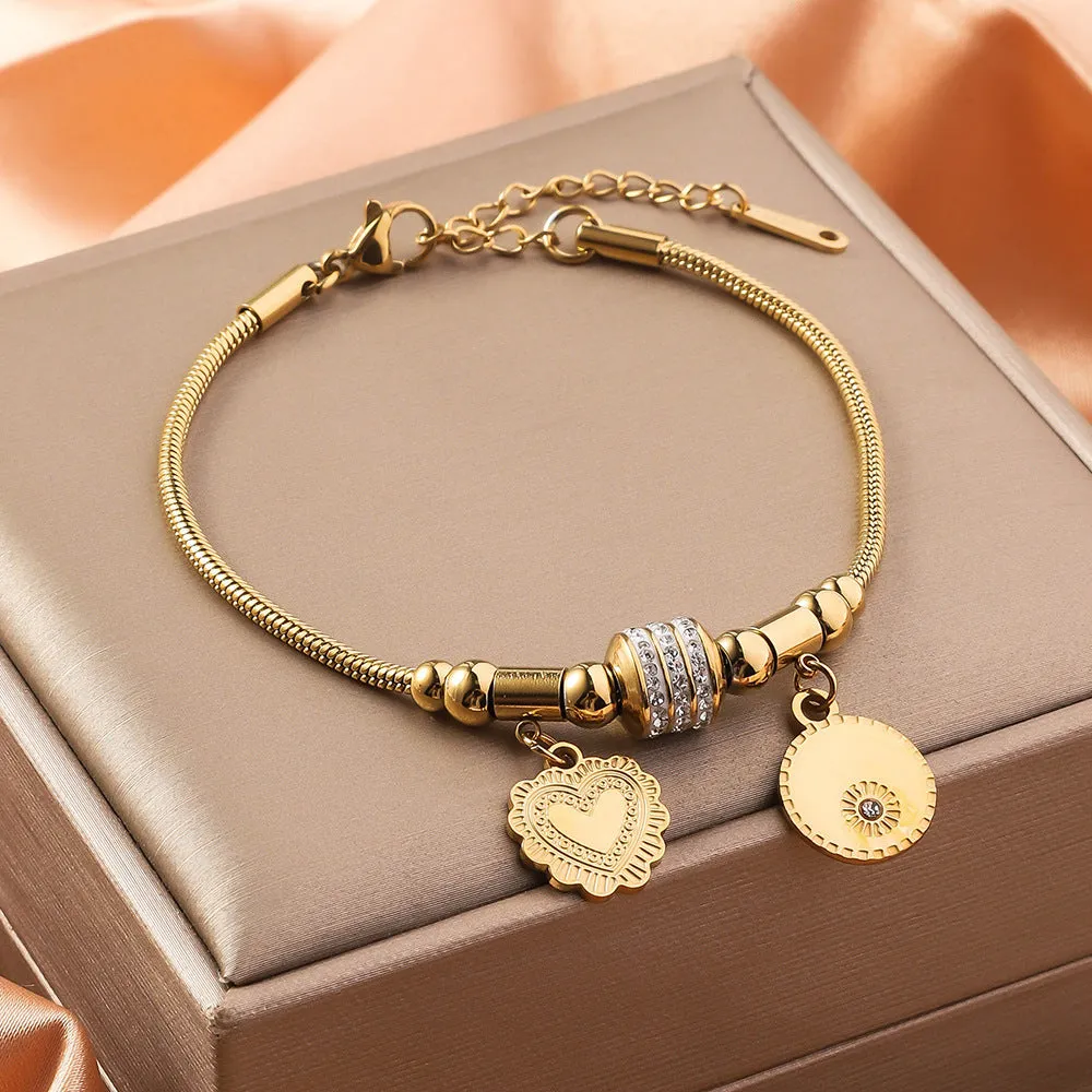 Titanium steel bracelet with electroplated colour and an inlaid shell design, showing pattern options like a five-pointed star.