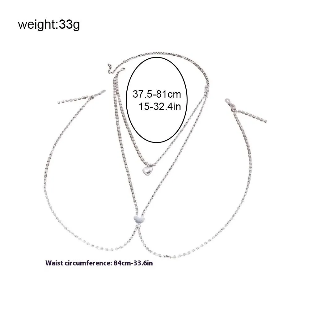 Gold or silver coloured heart-shaped body chain for women with rhinestone detailing.