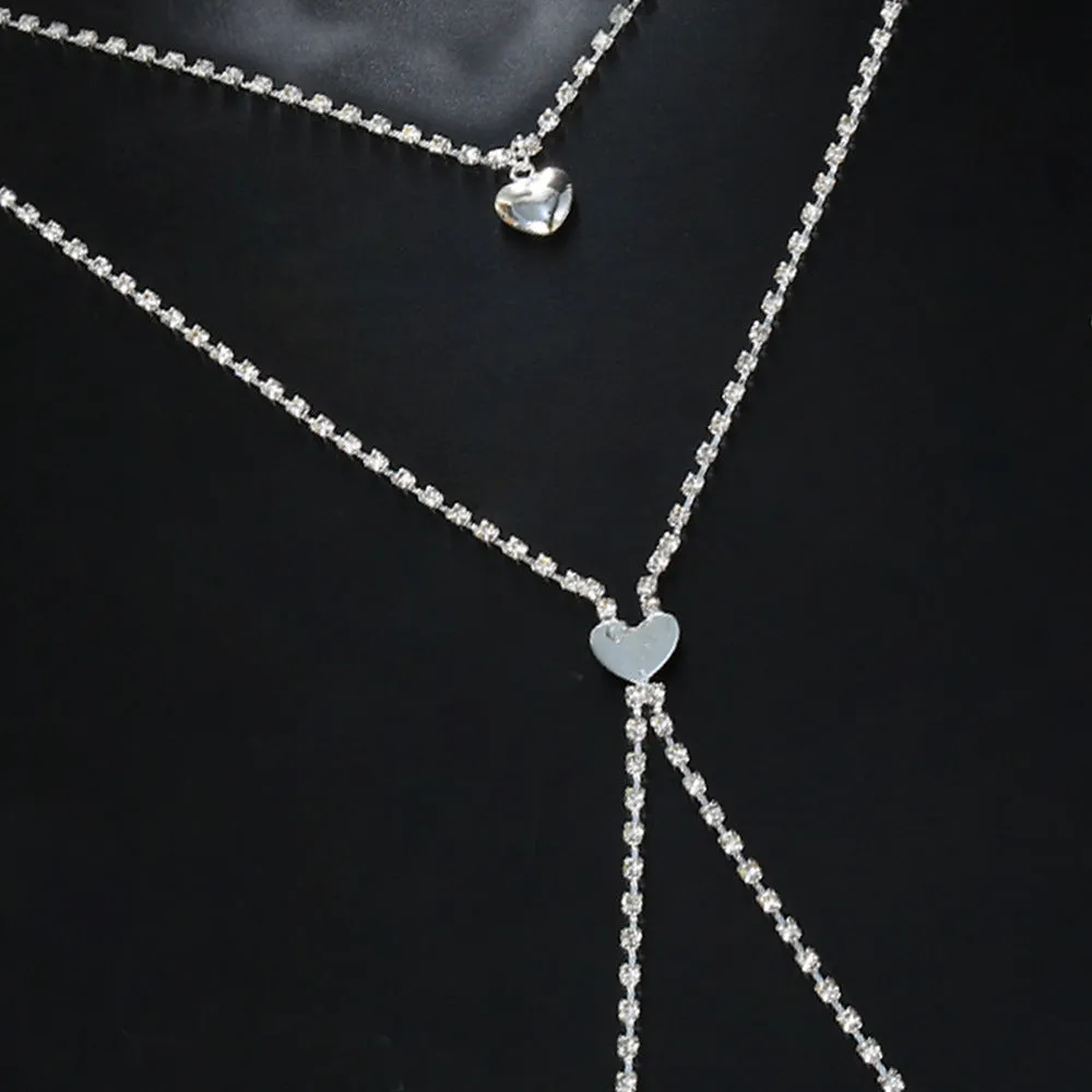 Gold or silver coloured heart-shaped body chain for women with rhinestone detailing.