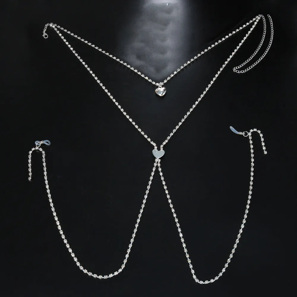 Gold or silver coloured heart-shaped body chain for women with rhinestone detailing.