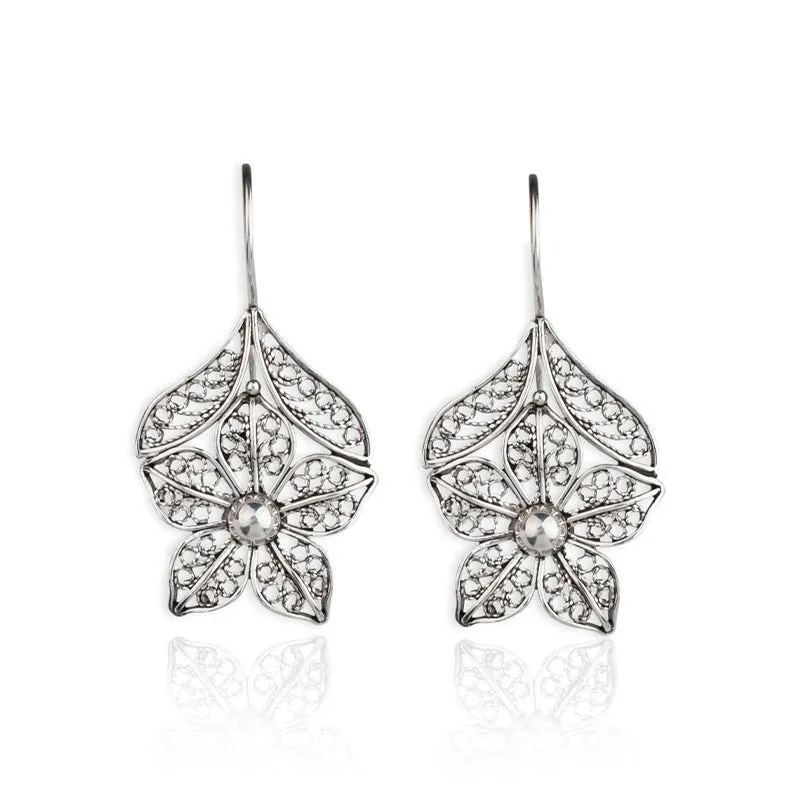 Silver alloy hollow flower leaf-shaped women's earrings with retro floral metal design