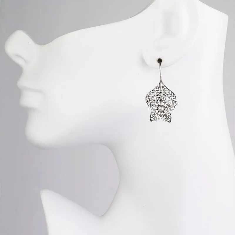 Silver alloy hollow flower leaf-shaped women's earrings with retro floral metal design