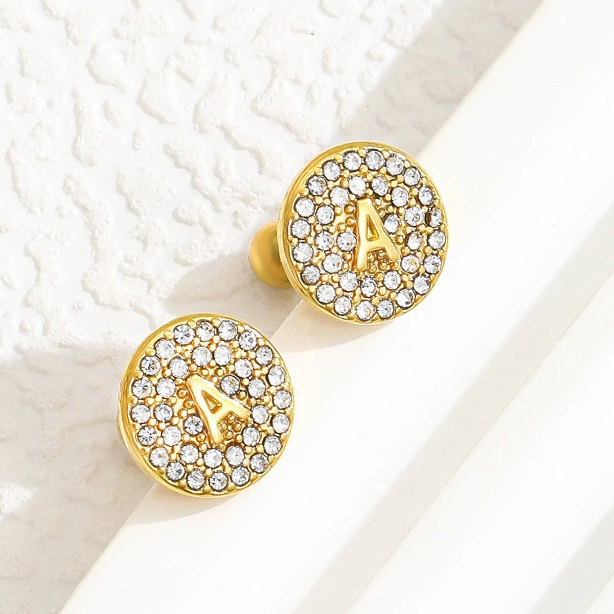 Round micro inlaid zircon stainless steel stud earring with real gold plating, English letter A on a unisex college style earring