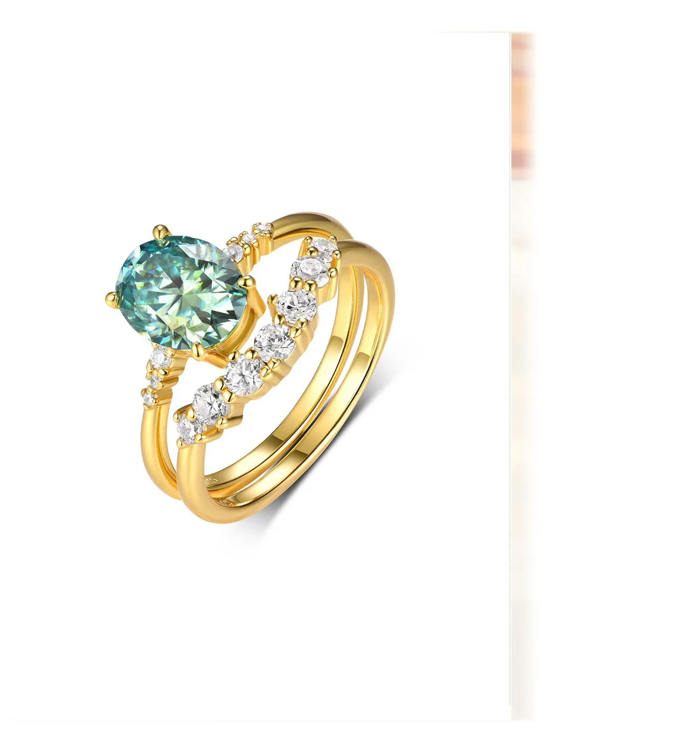 Gold S925 silver ring set with green moissanite stone, crown and geometric design, stacked on finger.