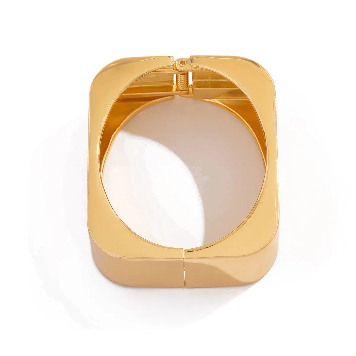 Metal texture glossy spring bracelet with geometric square mirror design in gold colour on white background