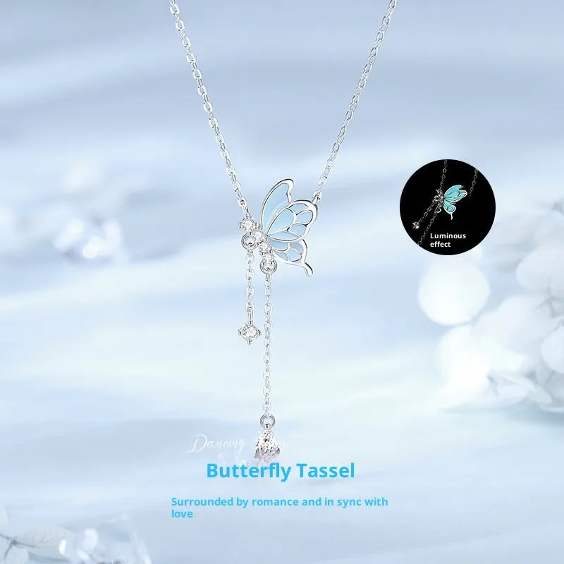 Sterling silver S925 butterfly tassel necklace with noctilucent luminous pendant and adjustable O-ring chain on white background