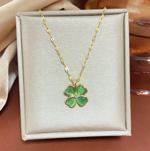 Titanium steel golden clavicle chain with geometric four-leaf flower design on unisex display