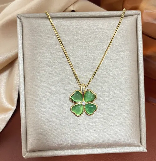 Titanium steel golden clavicle chain with geometric four-leaf flower design on unisex display