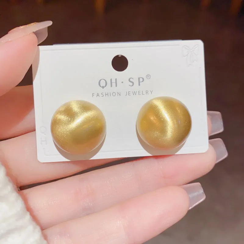 Simple round copper earrings in gold colour with electroplated finish