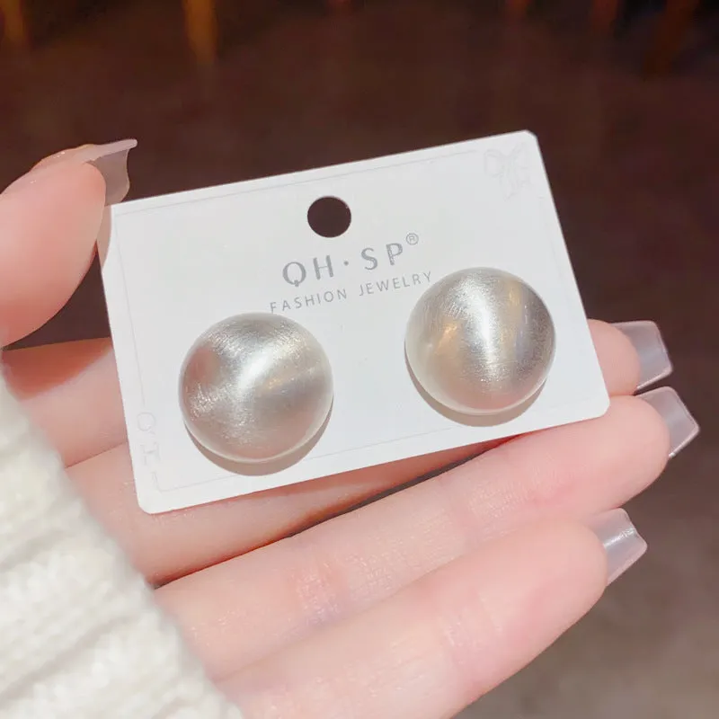 Simple round copper earrings in gold colour with electroplated finish