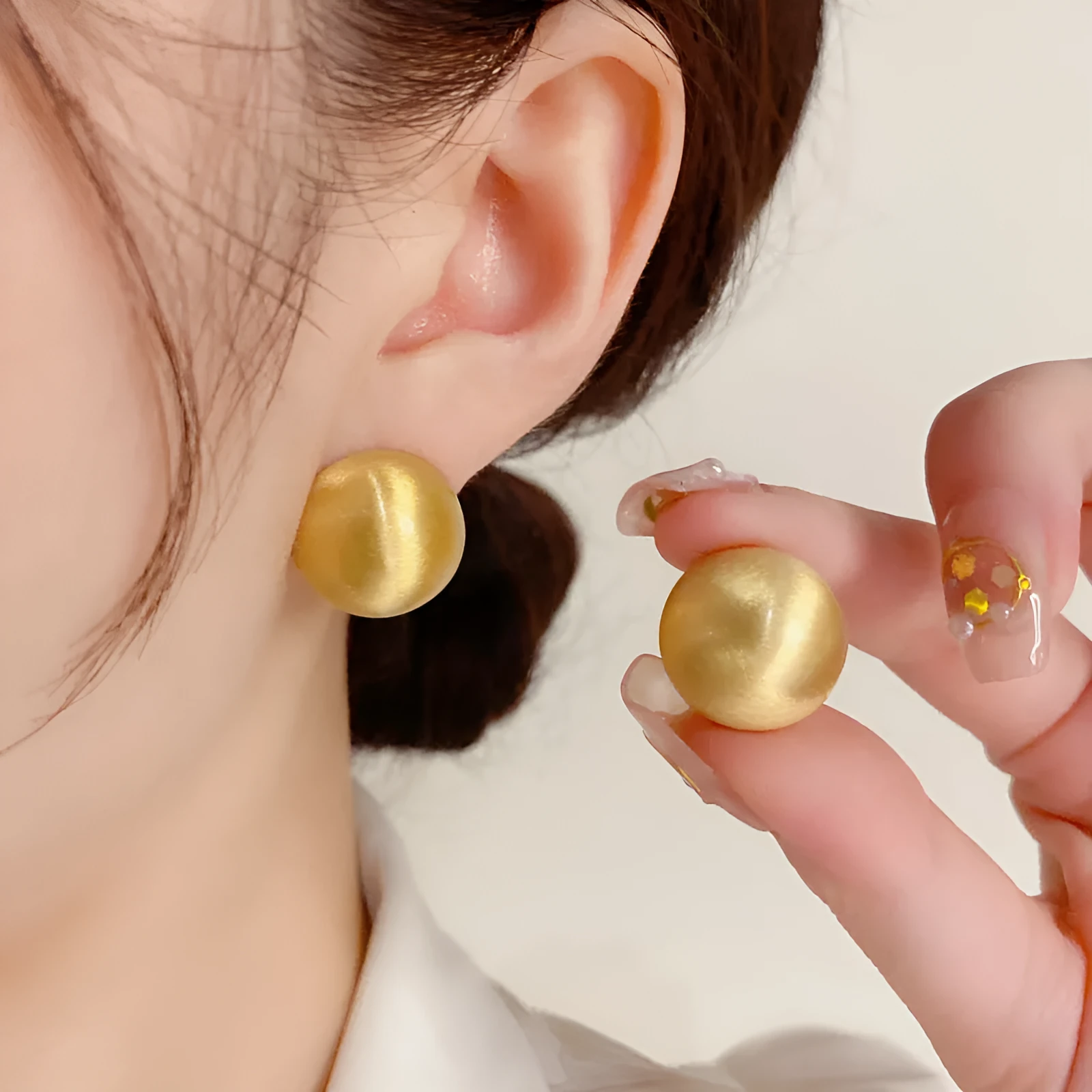 Simple round copper earrings in gold colour with electroplated finish