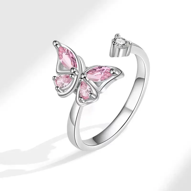 Butterfly adjustable ring with electroplated white gold finish and blue diamond accent on copper base