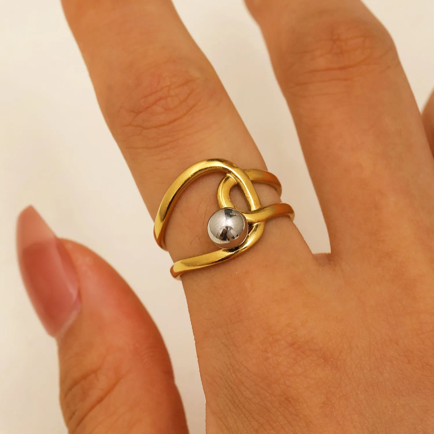 Geometric hollow line open ring in 304 stainless steel with 18K real gold finish, ellipse design