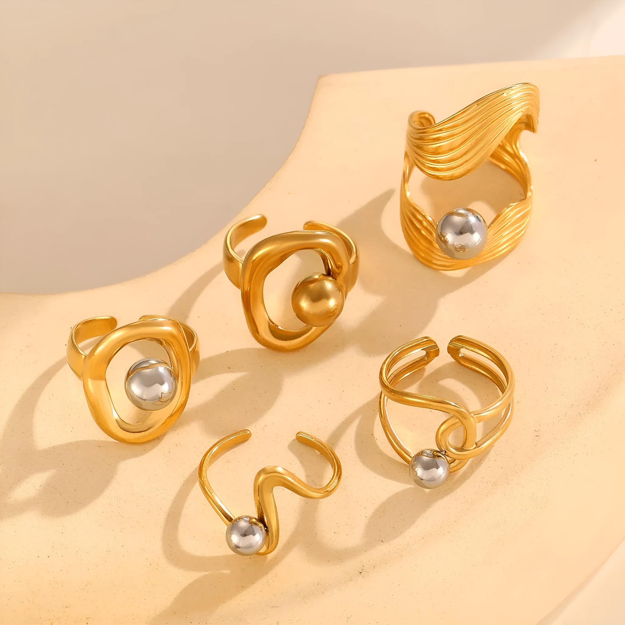 Geometric hollow line open ring in 304 stainless steel with 18K real gold finish, ellipse design