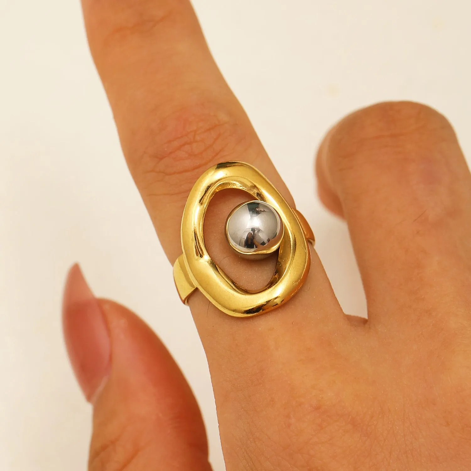 Geometric hollow line open ring in 304 stainless steel with 18K real gold finish, ellipse design