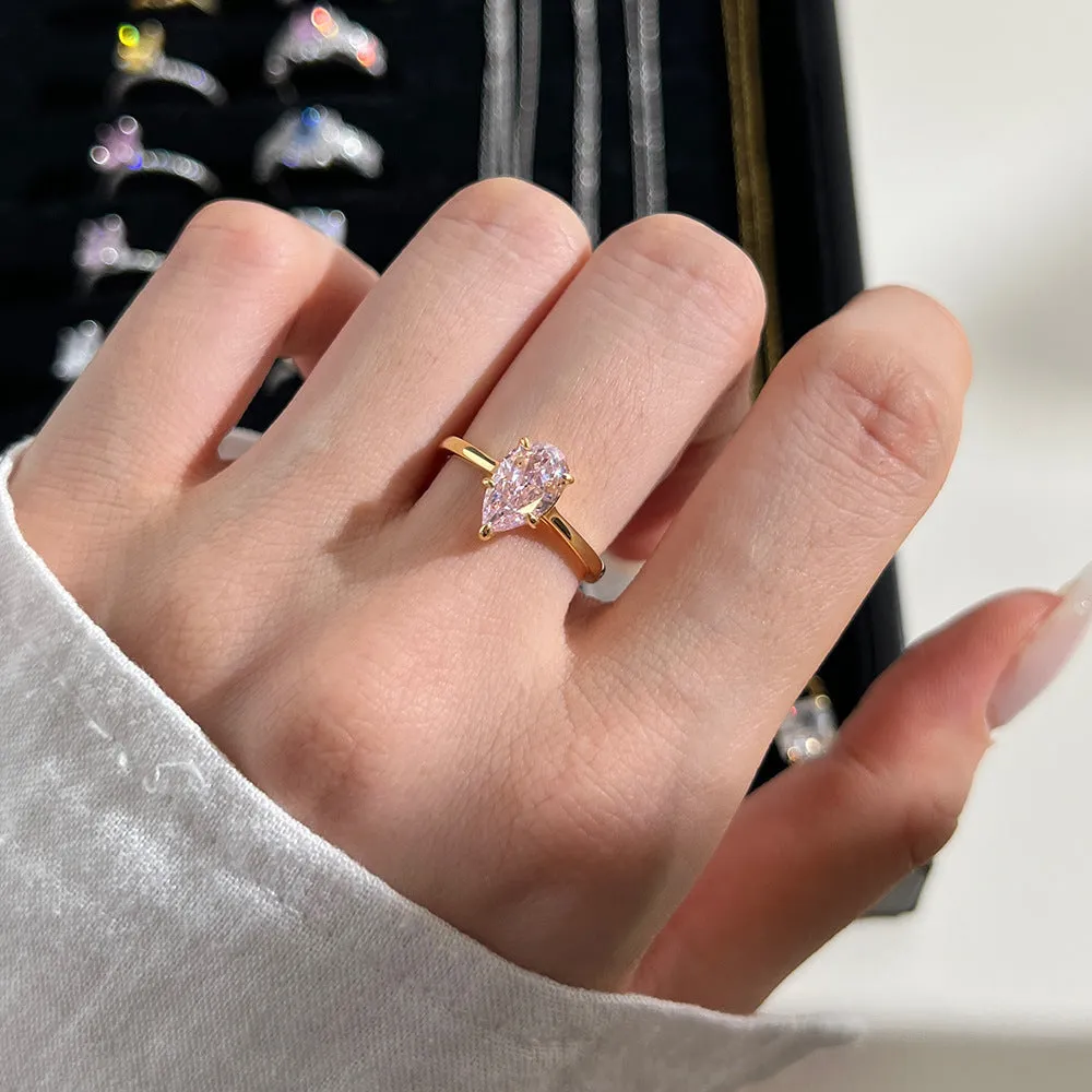 Sterling silver ring with pear-shaped high-grade zircon inlay, closed band, electroplated finish, multiple colours available