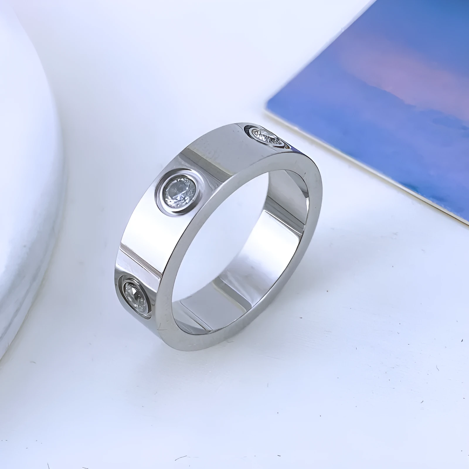 Titanium steel rhinestone couple ring in rose gold 5MM width on white background