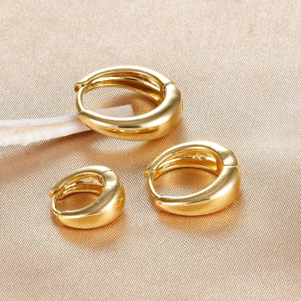 Geometric copper earring set of 3 glossy gold electroplated round shape earrings on display