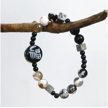 Hand-woven natural black agate and ceramic bracelet with geometric round bead design